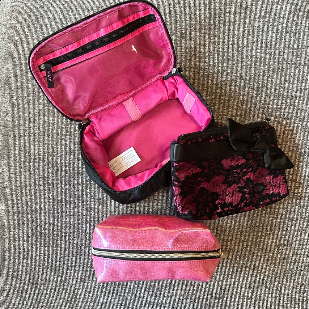 Set of three pink and black cosmetic bags